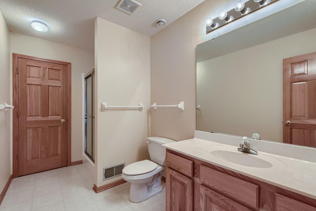 bathroom featuring a stall shower, toilet, and visible vents