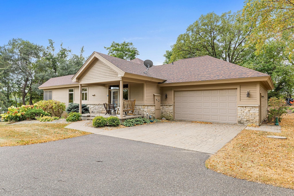 view of front of house with a garage and a porch