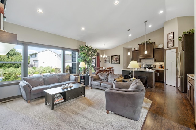 living room featuring high vaulted ceiling, a notable chandelier, recessed lighting, visible vents, and dark wood finished floors