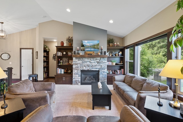 living room featuring an inviting chandelier, a fireplace, vaulted ceiling, and recessed lighting