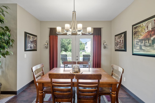 dining room with baseboards, dark wood-type flooring, and an inviting chandelier