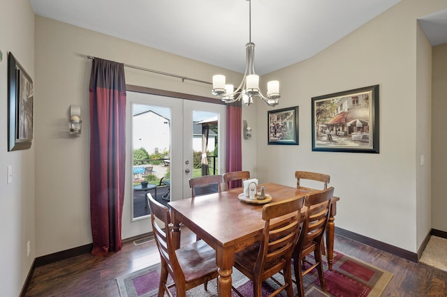 dining area featuring a chandelier, baseboards, dark wood finished floors, and french doors