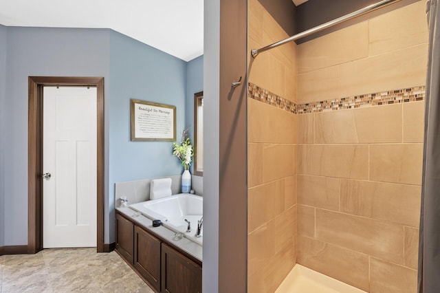 bathroom featuring a garden tub and a tile shower