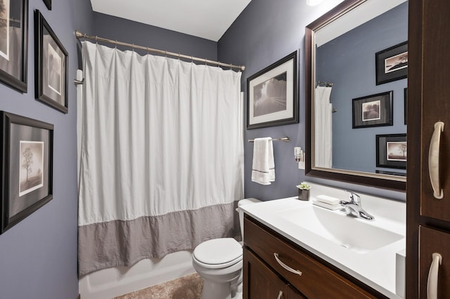 full bathroom with toilet, shower / tub combo with curtain, and vanity