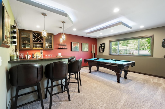 rec room featuring baseboards, wet bar, recessed lighting, and light colored carpet