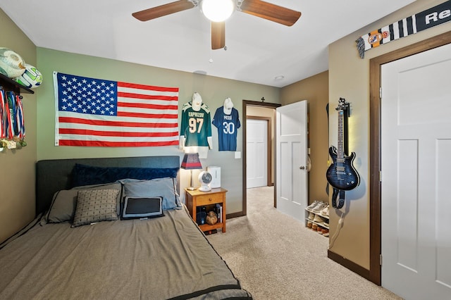 bedroom featuring carpet floors, a ceiling fan, and baseboards