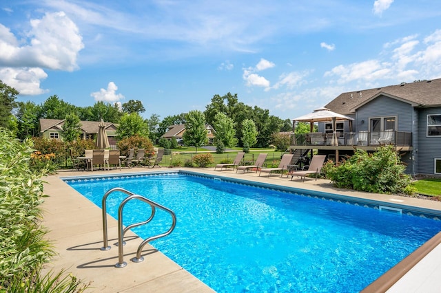 outdoor pool featuring a gazebo, a patio area, and fence