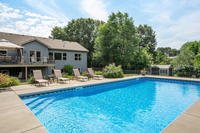 view of swimming pool featuring a gazebo, a patio area, fence, and a fenced in pool