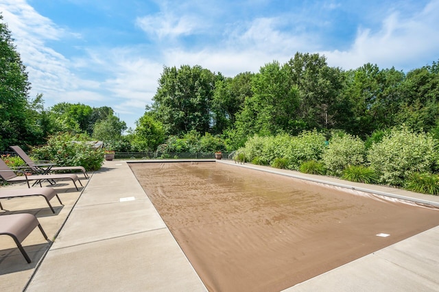 surrounding community with a patio area