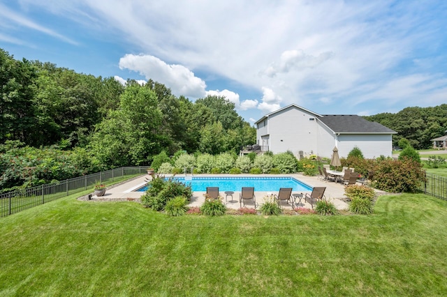 view of pool featuring a fenced in pool, fence, a lawn, and a patio