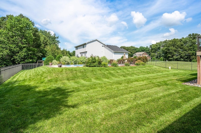 view of yard with a fenced backyard