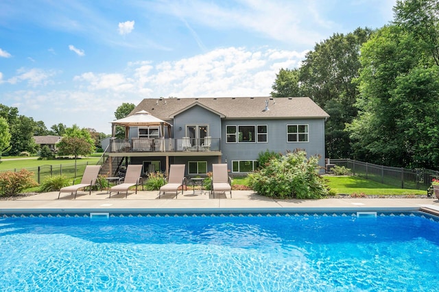 view of swimming pool featuring a fenced in pool, a patio area, fence, and a gazebo