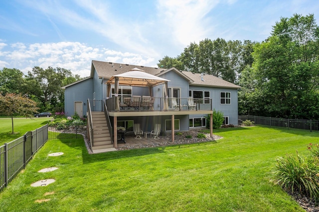 back of house featuring a deck, a fenced backyard, stairway, and a gazebo