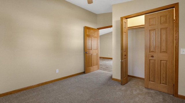 unfurnished bedroom with light carpet, a closet, and ceiling fan