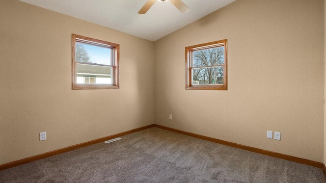 unfurnished room featuring ceiling fan, carpet flooring, and vaulted ceiling