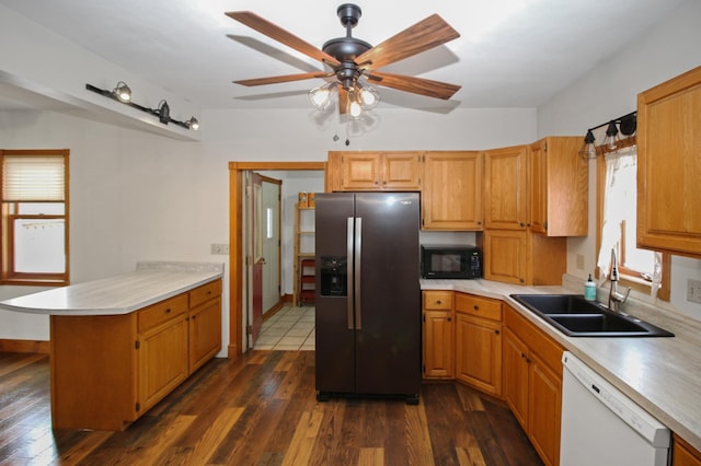 kitchen featuring white dishwasher, dark hardwood / wood-style floors, kitchen peninsula, and stainless steel refrigerator with ice dispenser