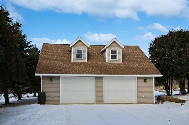 view of snow covered garage