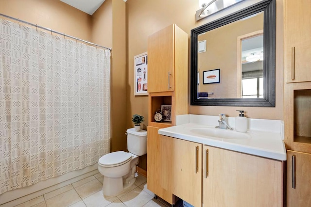 bathroom featuring tile patterned flooring, toilet, vanity, and a shower with curtain