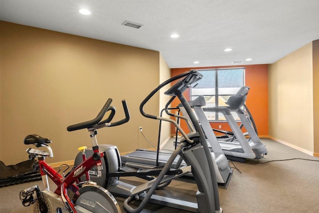 workout room featuring visible vents, baseboards, carpet flooring, recessed lighting, and a textured ceiling