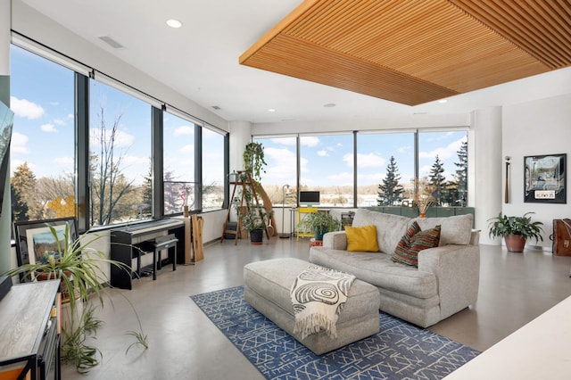 sunroom / solarium with wooden ceiling and visible vents