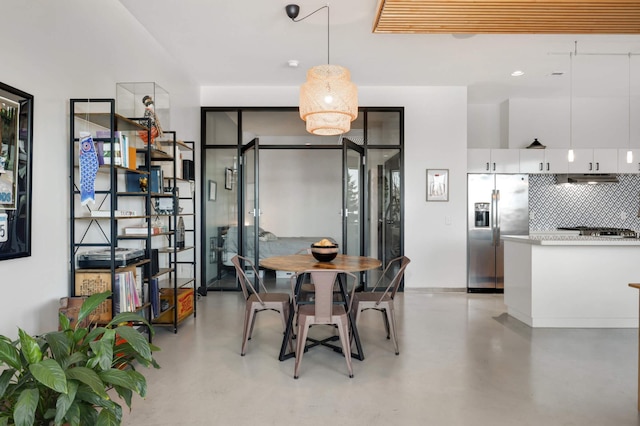 dining space with finished concrete floors