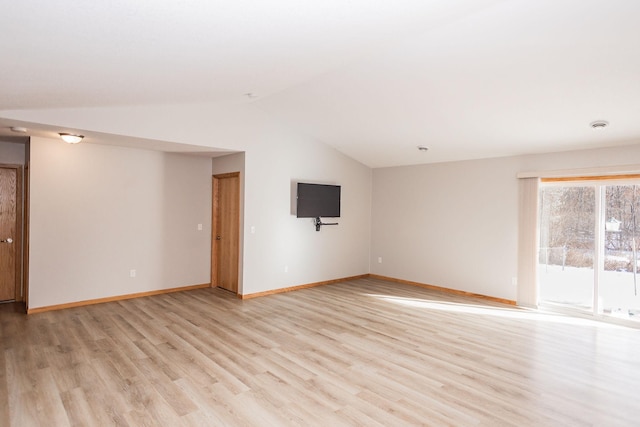 unfurnished living room with lofted ceiling and light hardwood / wood-style floors