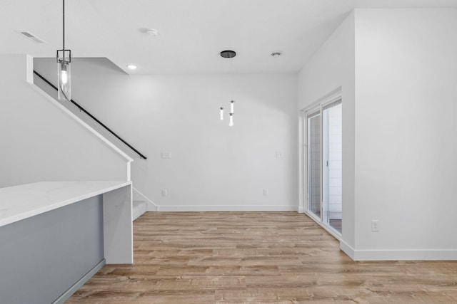 425 8th St Unit 23, New Richmond, WI 54017 - foyer with light wood-type flooring, stairs, recessed lighting, and baseboards
