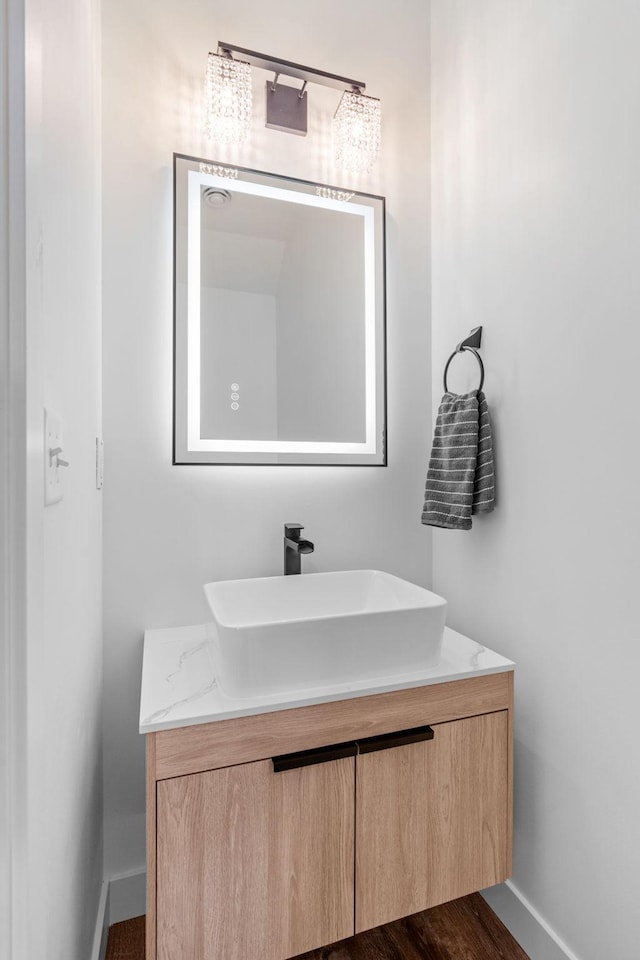 425 8th St Unit 23, New Richmond, WI 54017 - bathroom with baseboards and vanity