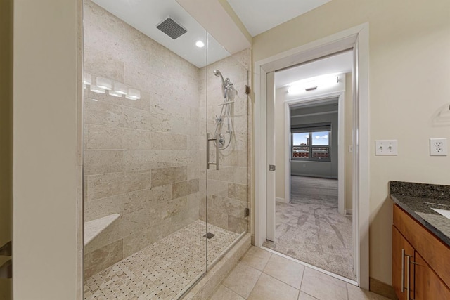 929 Portland Ave Unit 406, Minneapolis, MN 55404 - full bathroom with tiled shower, tile patterned flooring, baseboards, and vanity