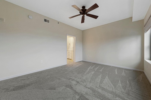 929 Portland Ave Unit 406, Minneapolis, MN 55404 - carpeted spare room featuring ceiling fan, baseboards, and a smoke detector