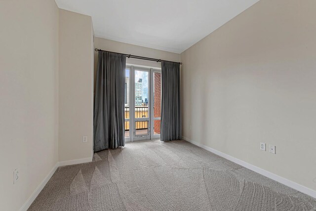 929 Portland Ave Unit 406, Minneapolis, MN 55404 - spare room with carpet floors and baseboards