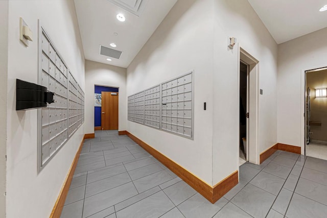 929 Portland Ave Unit 406, Minneapolis, MN 55404 - hallway with mail area, light tile patterned floors, baseboards, and recessed lighting