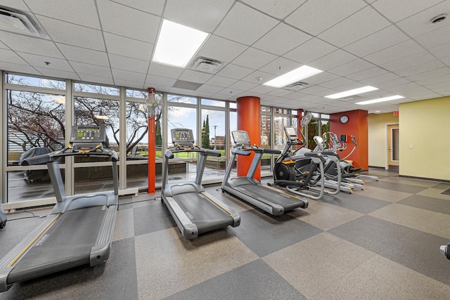 929 Portland Ave Unit 406, Minneapolis, MN 55404 - exercise room with healthy amount of natural light, a drop ceiling, and baseboards