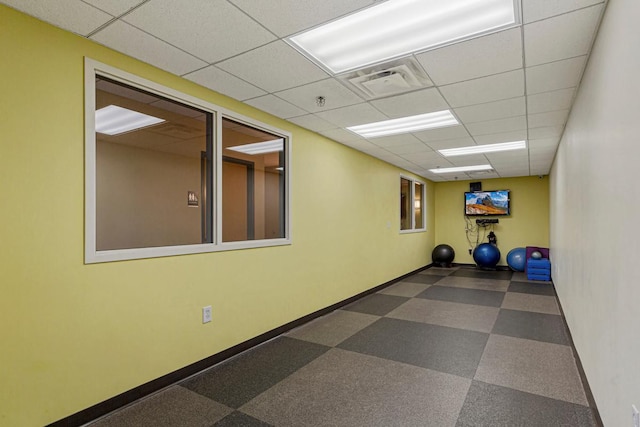 929 Portland Ave Unit 406, Minneapolis, MN 55404 - workout area featuring a paneled ceiling, tile patterned floors, and baseboards