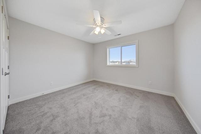 carpeted empty room with ceiling fan