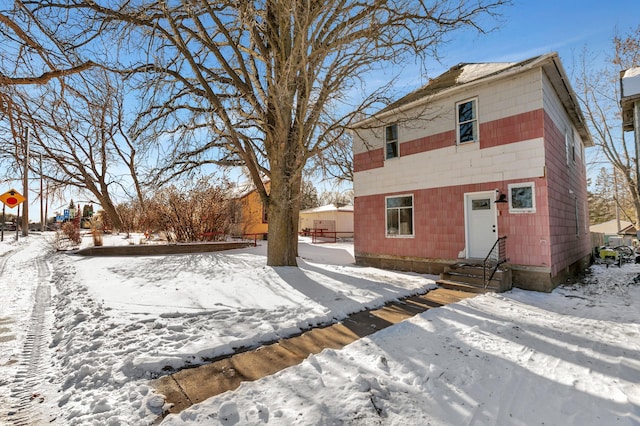 view of snow covered house