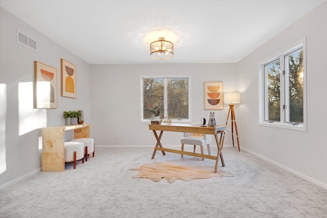 office with an inviting chandelier and carpet floors