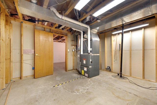 basement featuring heating unit