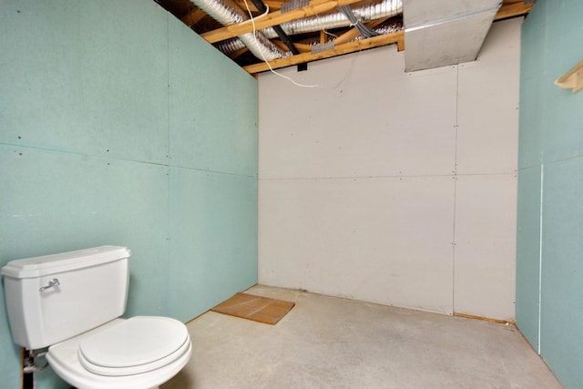 bathroom featuring toilet and concrete floors