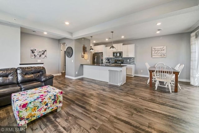 living room with dark hardwood / wood-style floors