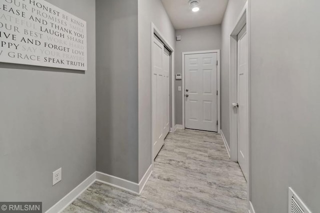 hallway featuring light wood-type flooring