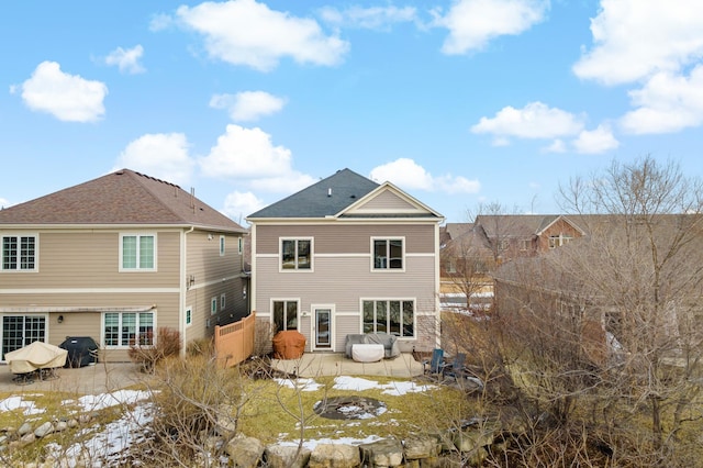 back of property featuring a patio