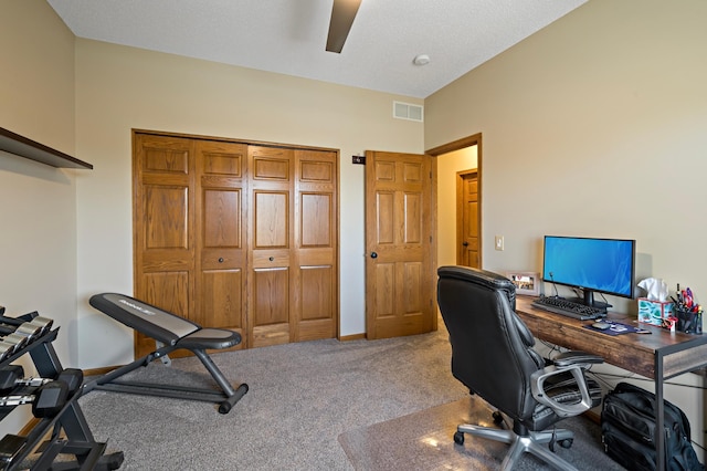 home office with carpet floors, visible vents, ceiling fan, and baseboards