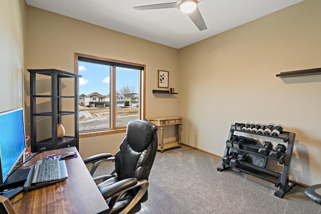 office area featuring carpet flooring, ceiling fan, a textured ceiling, and baseboards