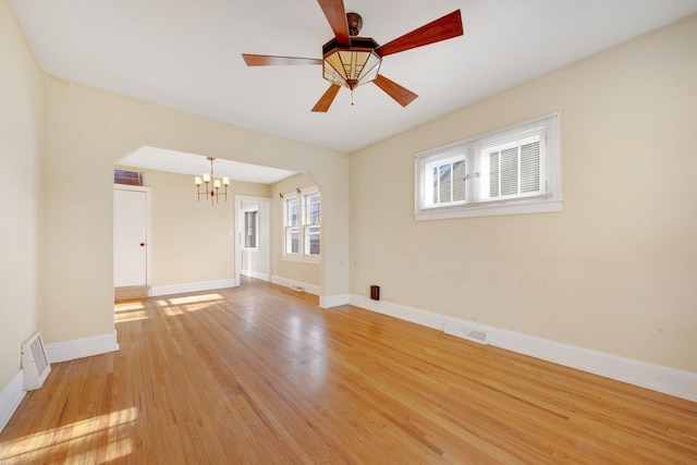 5421 30th Ave S, Minneapolis, MN 55417 - empty room featuring ceiling fan with notable chandelier and light hardwood / wood-style floors