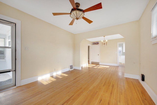 5421 30th Ave S, Minneapolis, MN 55417 - unfurnished living room with ceiling fan with notable chandelier and light hardwood / wood-style flooring
