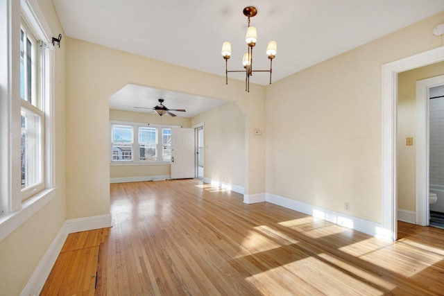 5421 30th Ave S, Minneapolis, MN 55417 - unfurnished living room featuring ceiling fan with notable chandelier and light hardwood / wood-style floors