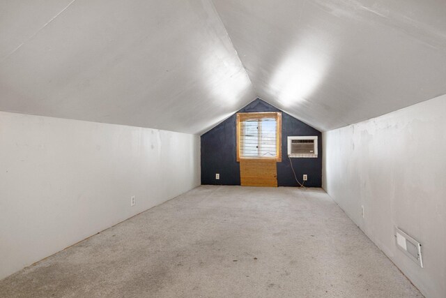 5421 30th Ave S, Minneapolis, MN 55417 - bonus room with lofted ceiling, a wall mounted air conditioner, and light colored carpet