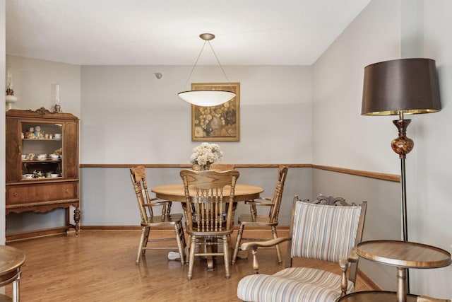 dining room with wood-type flooring