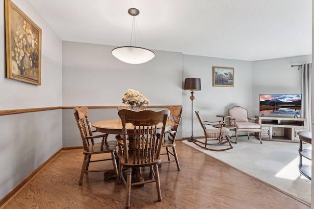 dining room with hardwood / wood-style floors